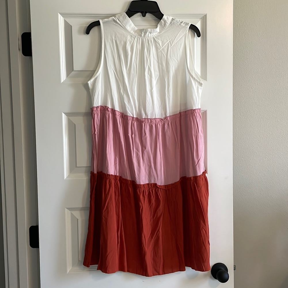 Sleeveless dress. Size M Never worn multi-color. Boutique dress.